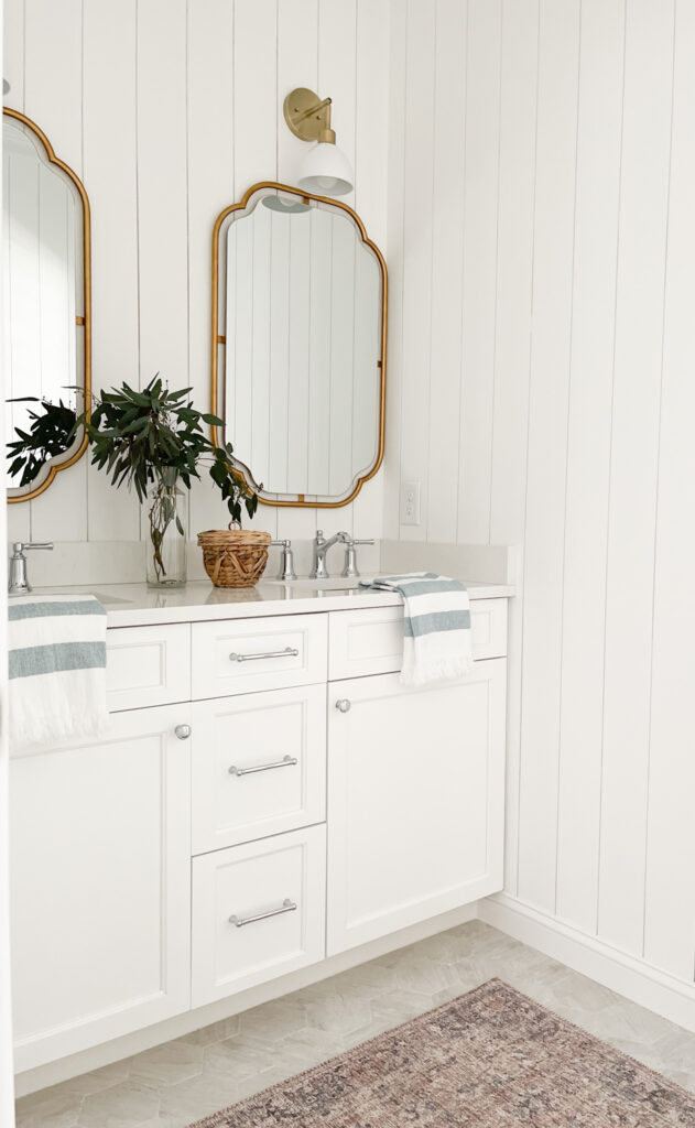 mixed metal vanity with vertical shiplap