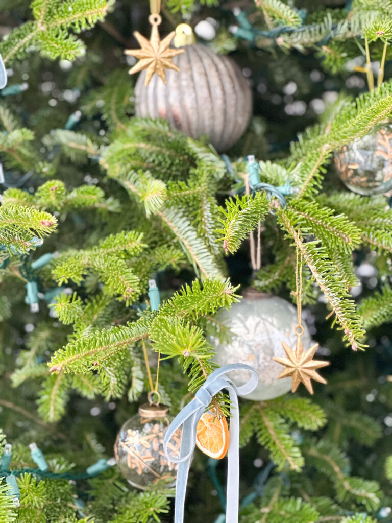 ornaments on blue christmas tree