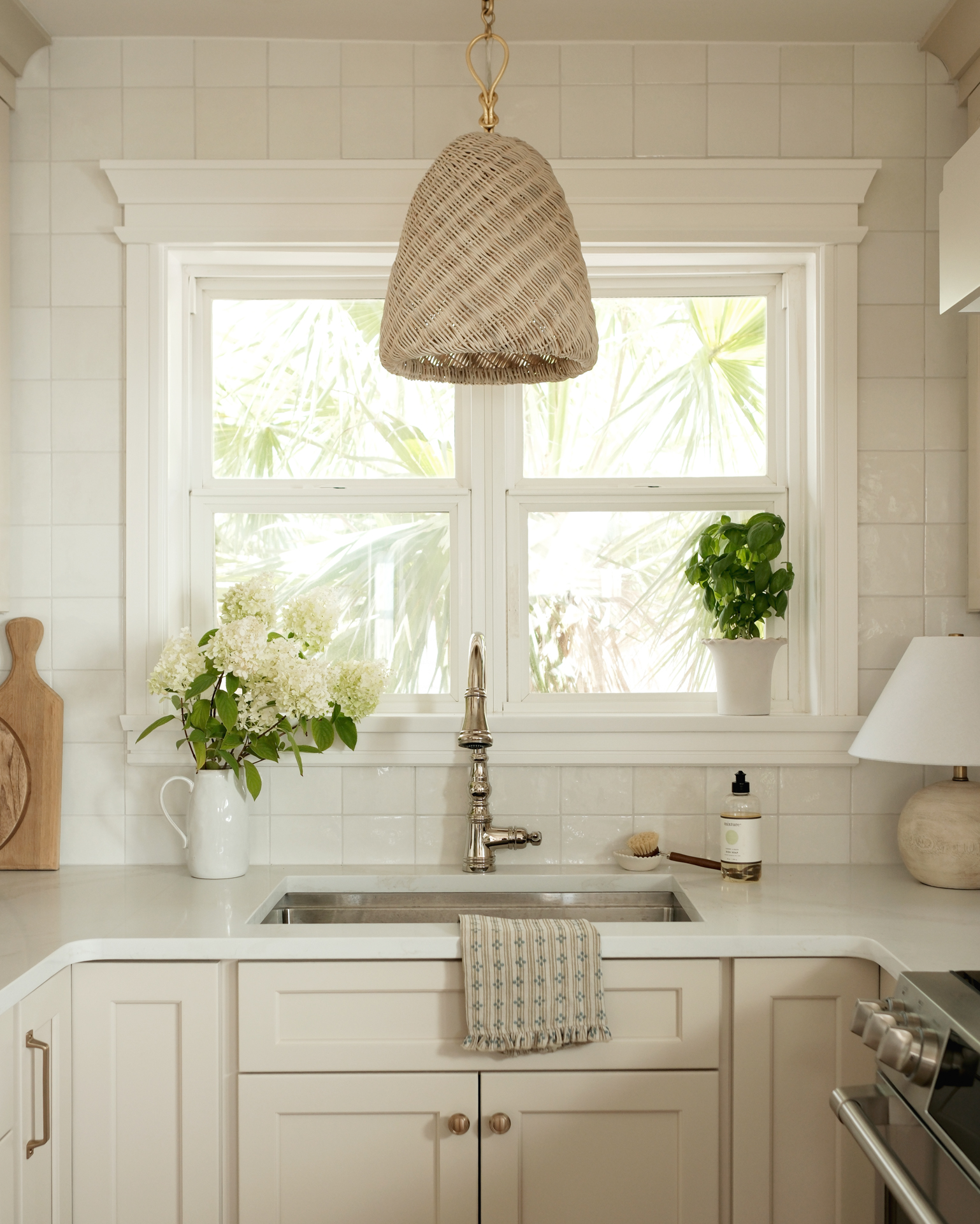 Charming Coastal Kitchen Corner with Statement Lighting